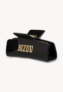 Black RHODI hair clip with logo.