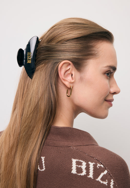 Black ROAR hair clip with gold logo