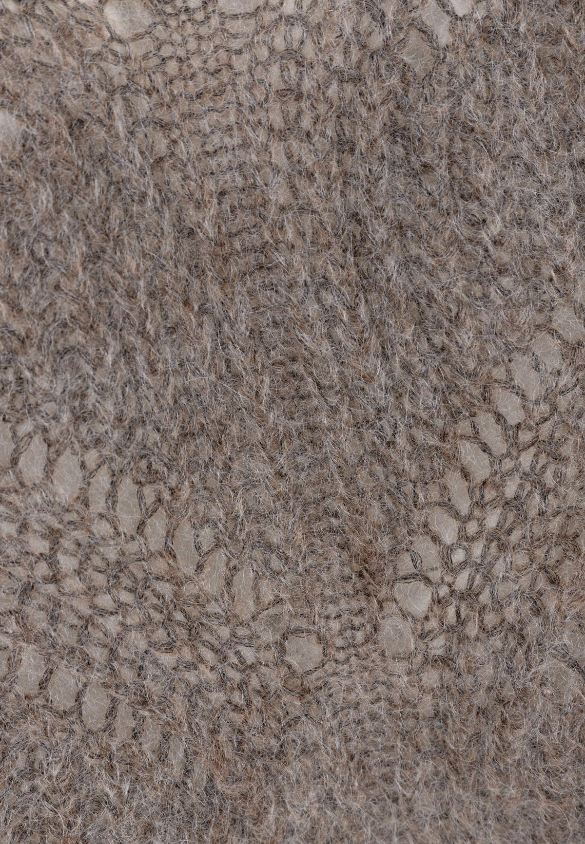 Close-up of the knit pattern on the beige ROSSO sweater.