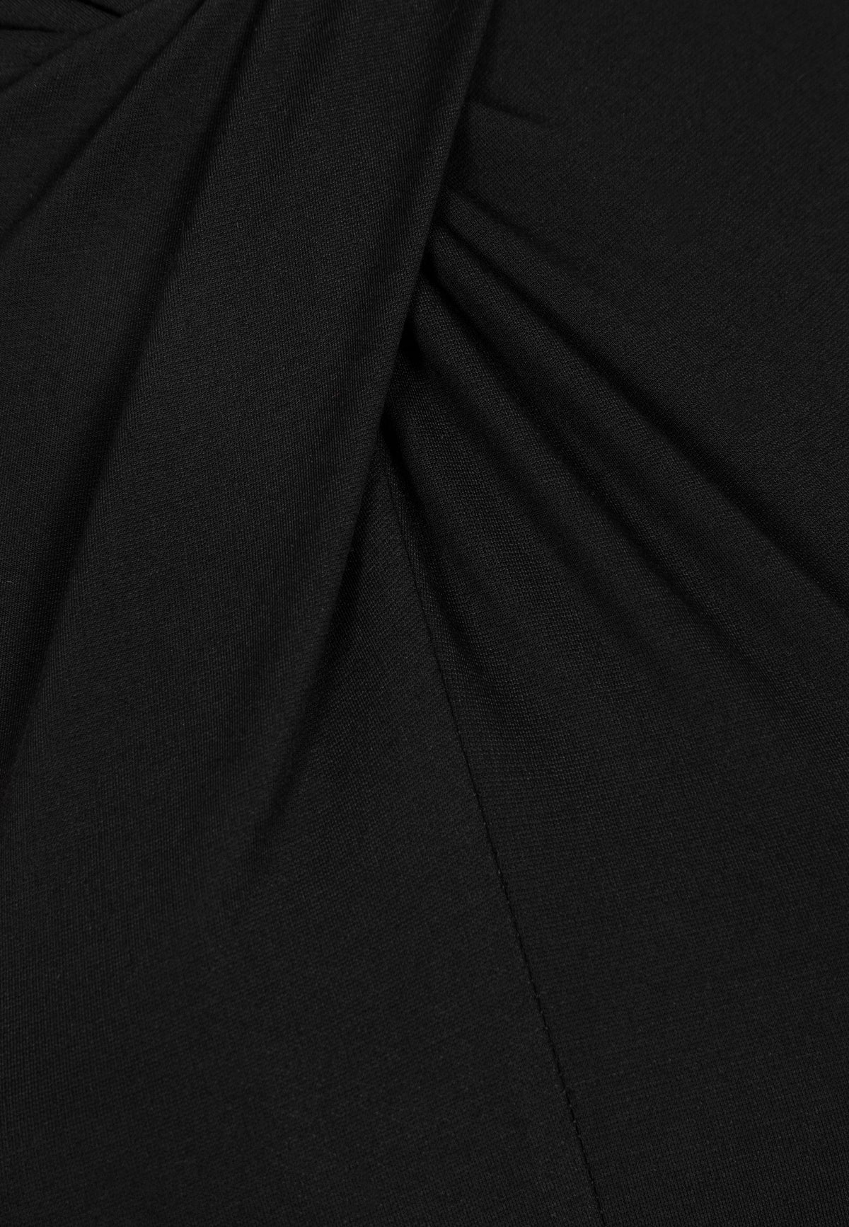 Close-up of the twist detail at the neckline in the black ROTTA dress.