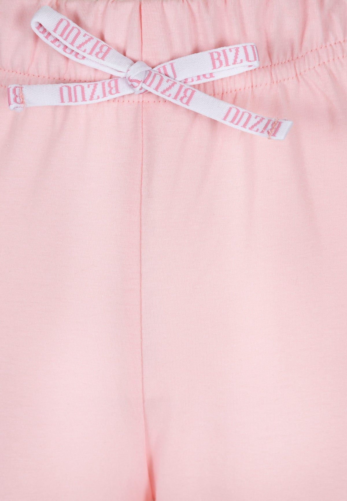 Close-up of the branded bow on the pink SAMPAJO pajama trousers.