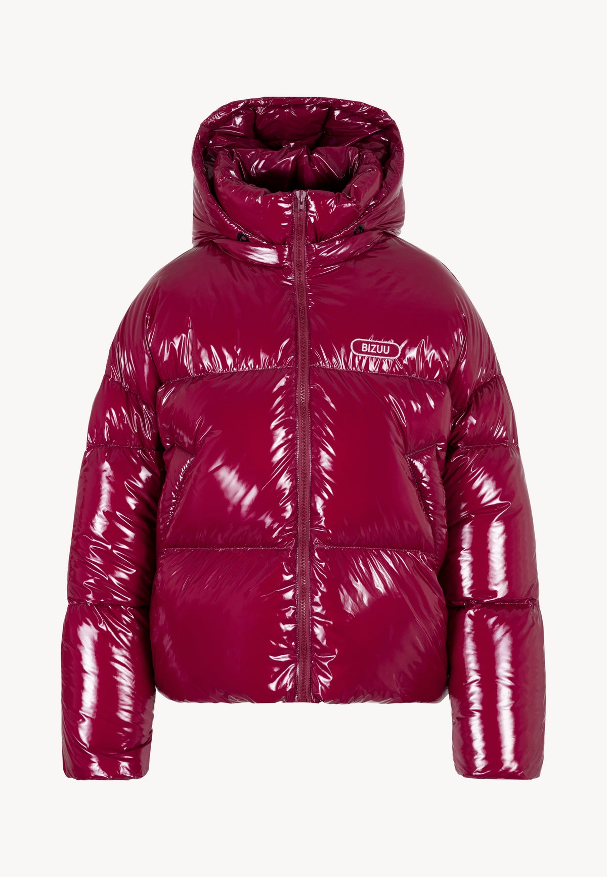 Model crouching on a bridge with the burgundy SANYA jacket draped over her shoulders, featuring a detachable hood and natural filling.