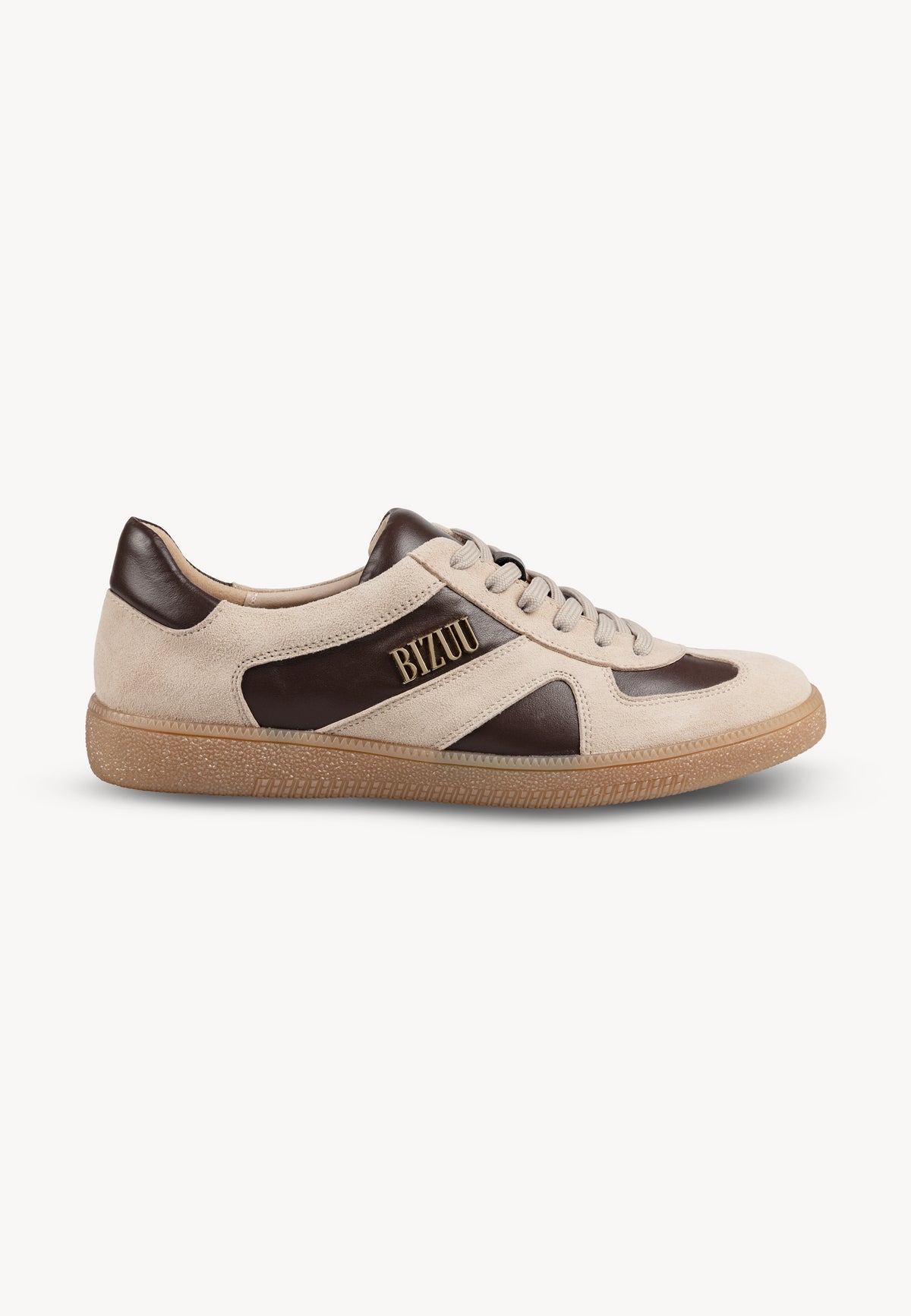Beige SODDY sneakers with brown inserts and a gold logo on the side, standing sideways.
