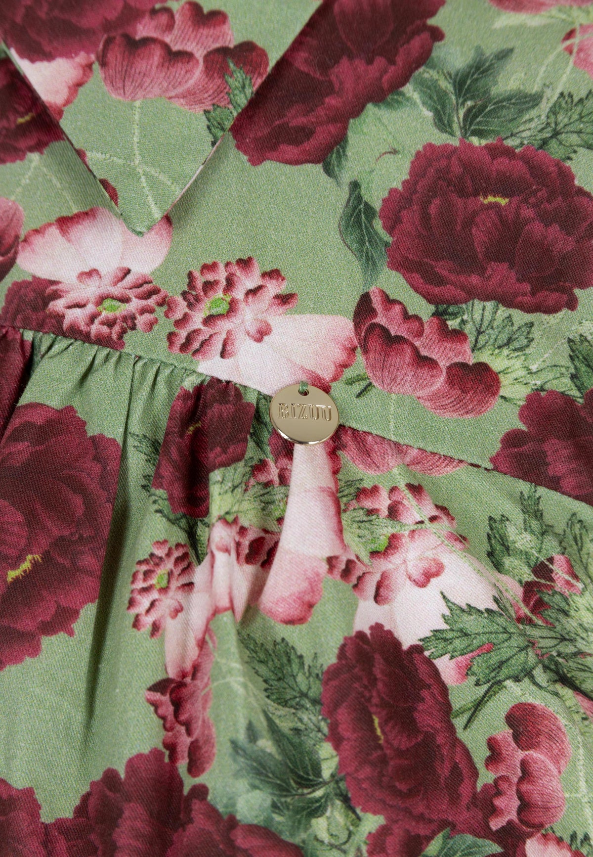 Close-up of the floral print on the SOREZIA dress.