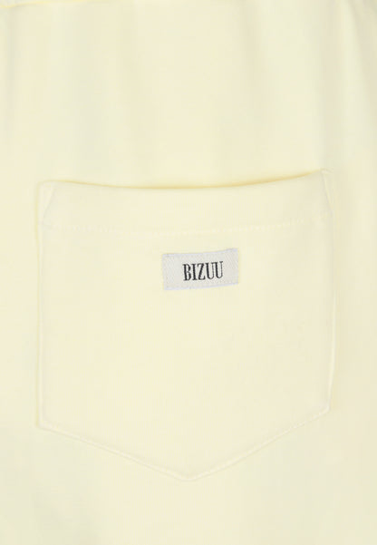 Yellow sweatpants with logoed label TASPY