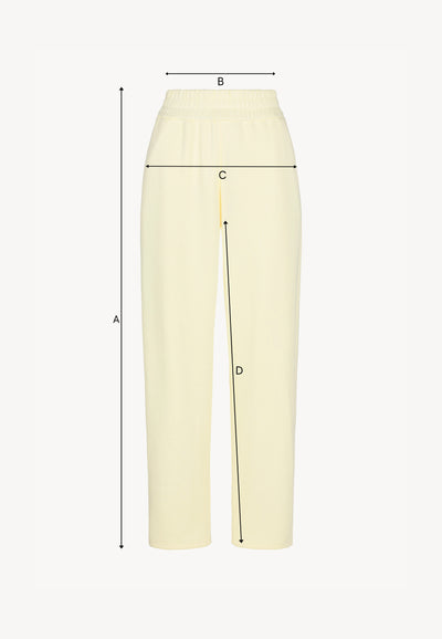 Yellow sweatpants with logoed label TASPY