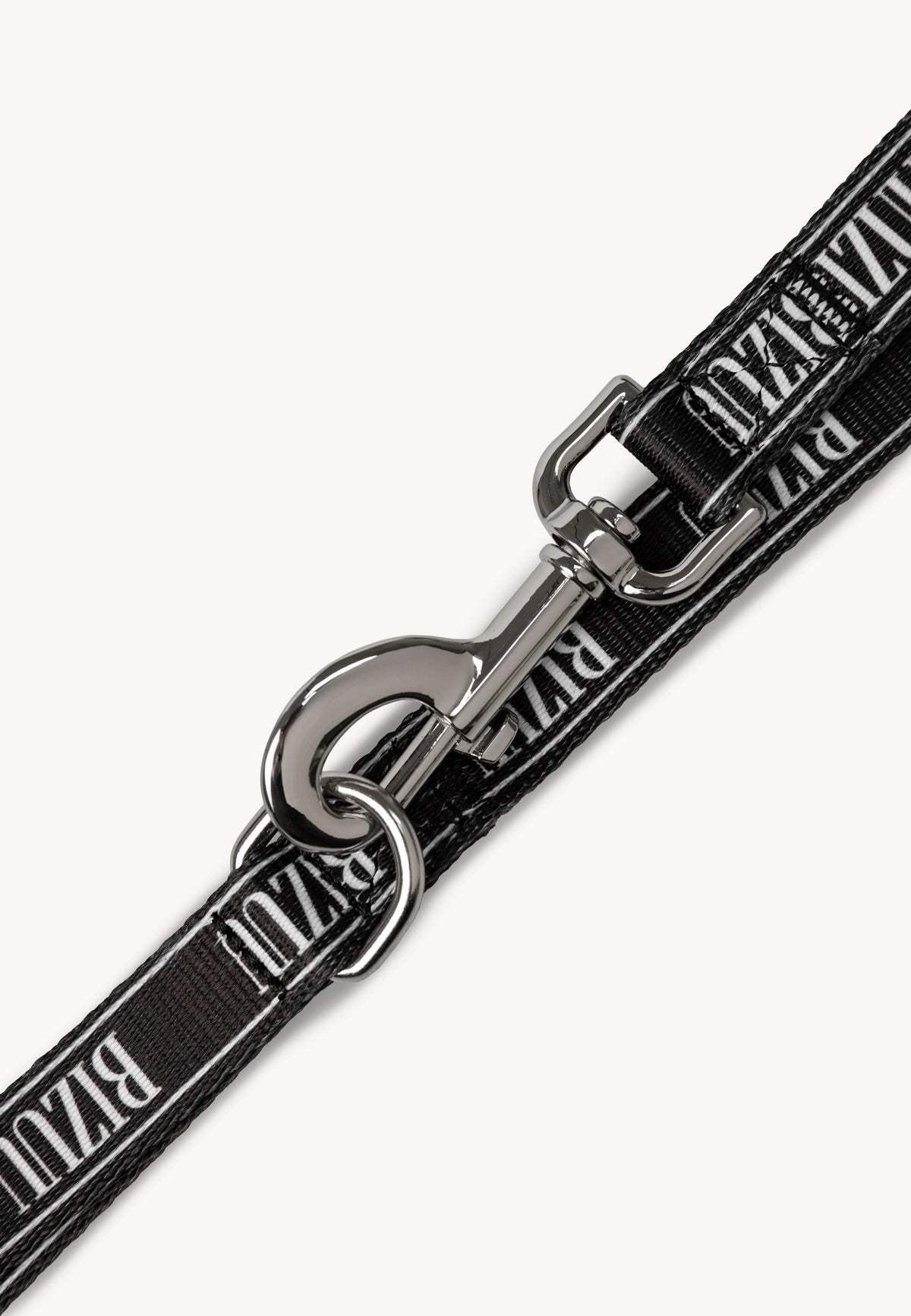Close-up of the snap hook used to fasten the black lanyard with the white BIZUU logo.