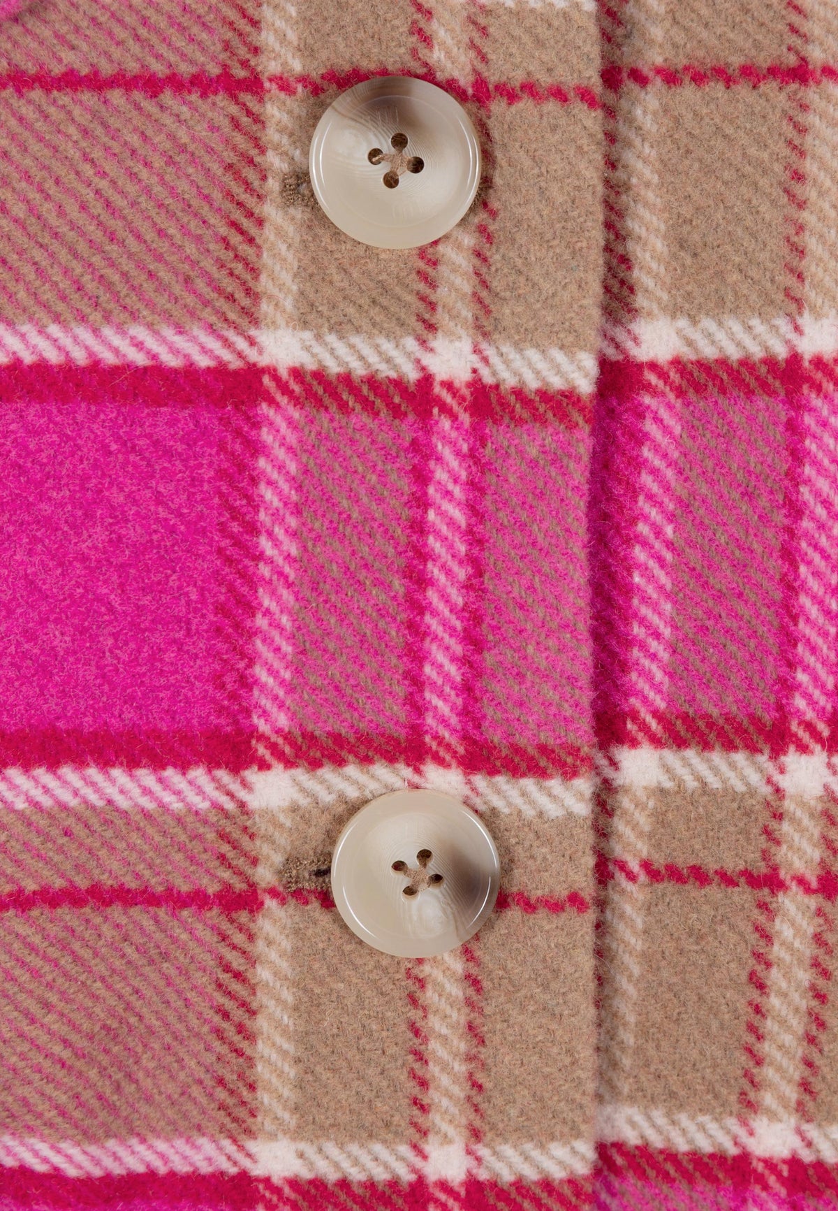 Close-up of the buttons on the pink WIVINA plaid coat.