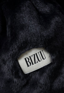 Black FLUFFY scarf with a branded label.