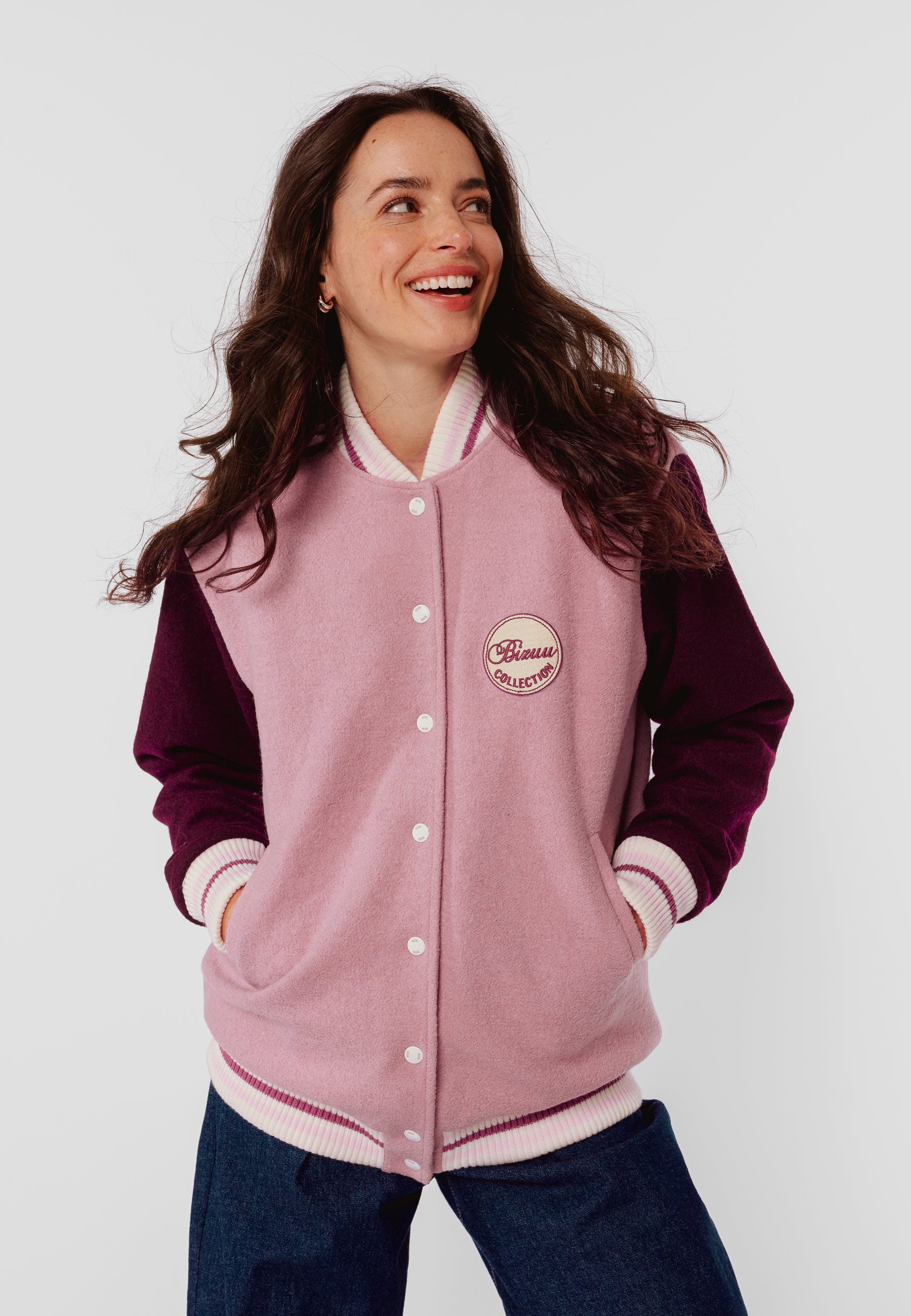 BASSIA pink bomber jacket with a logo patch on the back