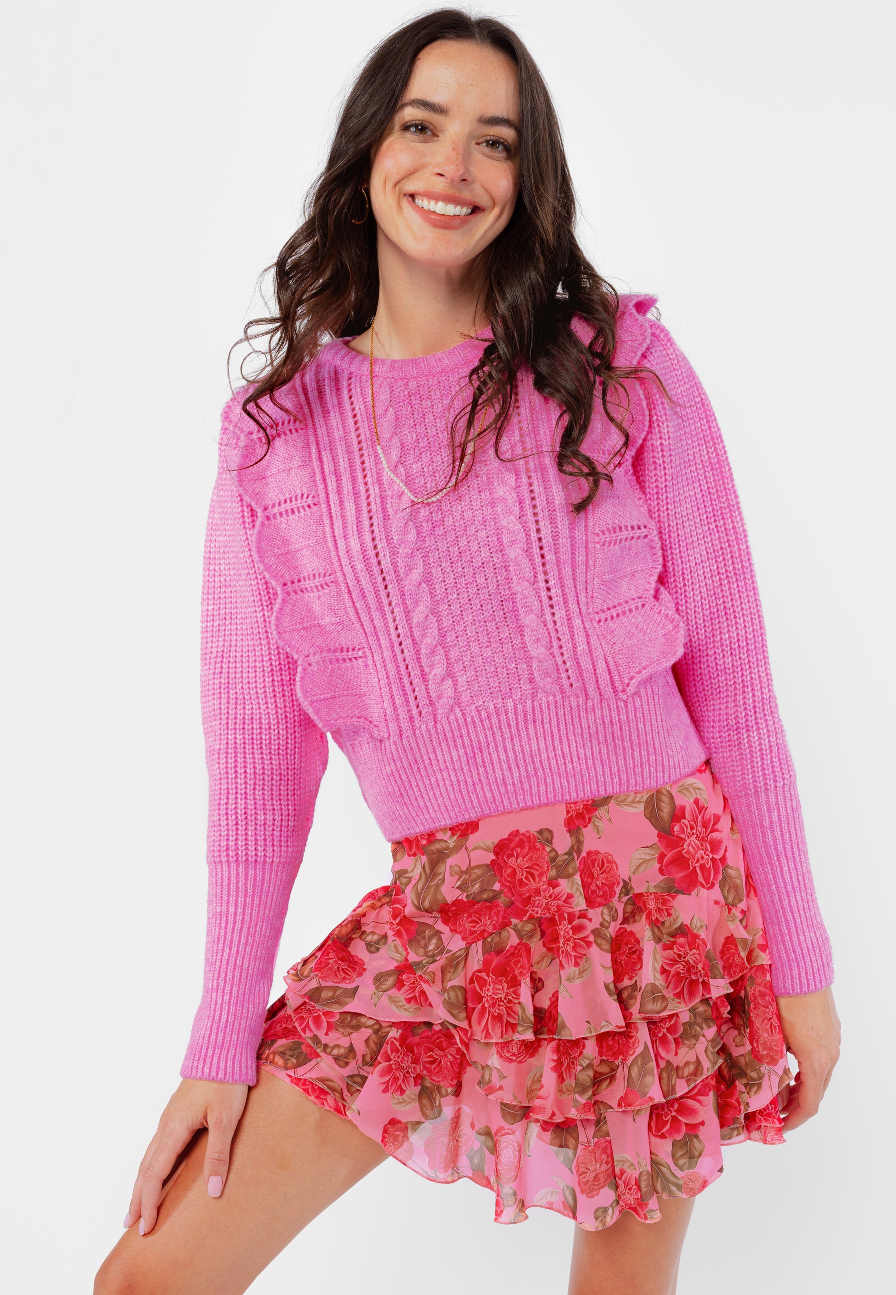 ELLI short pink jumper with an eye-catching ruffle