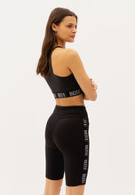 Load image into Gallery viewer, GRETIA black biker shorts with a branded side stripe